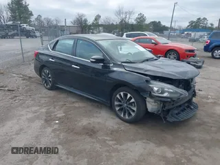 2019 Nissan Sentra S z VIN 3N1AB7AP7KY257655, wystawiony jako IAAI lot #41797422 z przebiegiem 89 676 mil mil oraz . Historia ofert i sprzedaży dostępna na DreamBid. Obrazek 1.