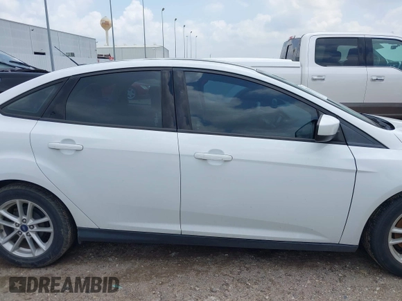 2018 Ford Focus SE z VIN 1FADP3F22JL292697, wystawiony jako IAAI lot #42094271 z przebiegiem 43 614 mil mil oraz . Historia ofert i sprzedaży dostępna na DreamBid. Obrazek 13.