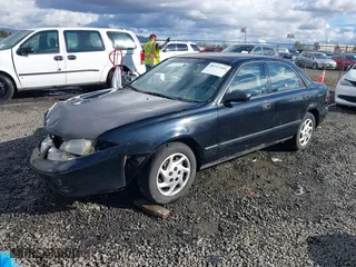 2000 Mazda 626 LX with VIN 1YVGF22CXY5123930, listed as a IAAI auction lot 40712369 with 210,234 mi miles. Bid and sale history available at carsss.com. Image 17.