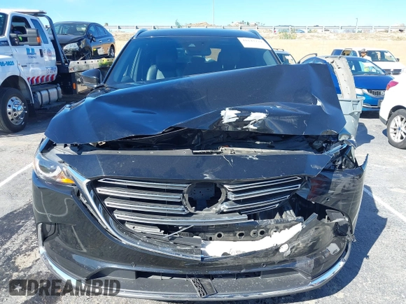 2018 Mazda CX-9 Grand Touring z VIN JM3TCADY8J0221221, wystawiony jako IAAI lot #41644721 z przebiegiem 41 510 mil mil oraz . Historia ofert i sprzedaży dostępna na DreamBid. Obrazek 12.