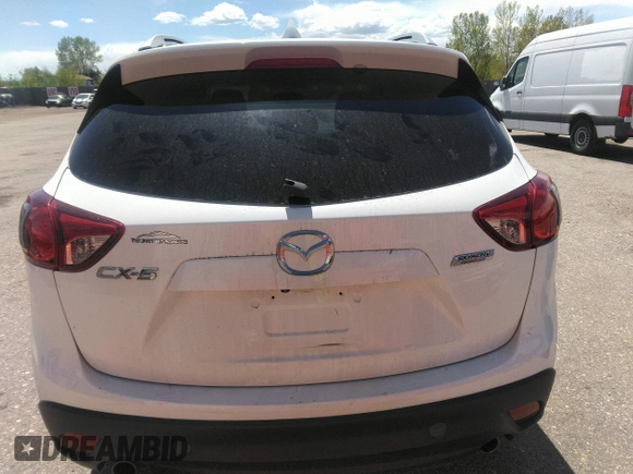 2014 Mazda CX-5 Touring with VIN JM3KE2CY7E0364311, listed as a IAAI auction lot 42108176 with 90,506 mi miles and . Bid and sale history available at DreamBid. Image 16.