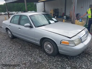 2000 Ford Crown Victoria with VIN 2FAFP73W6YX194471, listed as a IAAI auction lot 42102220 with 131,855 mi miles. Bid and sale history available at carsss.com. Image 1.