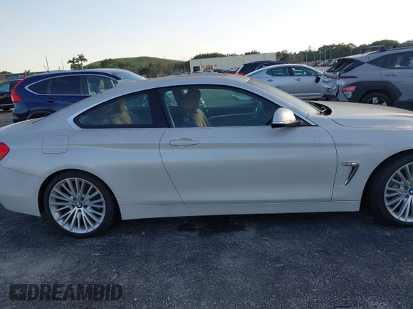 2014 BMW 4 Series 435i with VIN WBA3R1C51EK192795, listed as a IAAI auction lot 41263037 with 22,937 mi miles and . Bid and sale history available at DreamBid. Image 13.
