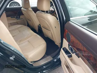 2015 Jaguar XJ with VIN SAJWA1CZ9F8V78228, listed as a IAAI auction lot 41260138 with 52,622 mi miles. Bid and sale history available at carsss.com. Image 8.