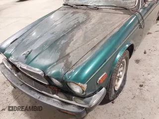 1985 Jaguar XJ with VIN SAJAV1347FC414864, listed as a IAAI auction lot 42118511 with 117,185 mi miles and . Bid and sale history available at DreamBid. Image 6.