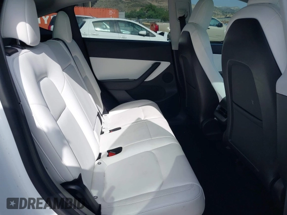 2021 Tesla Model Y Long Range with VIN 5YJYGDEE0MF069451, listed as a IAAI auction lot 41482649 with 55,542 mi miles. Bid and sale history available at carsss.com. Image 8.