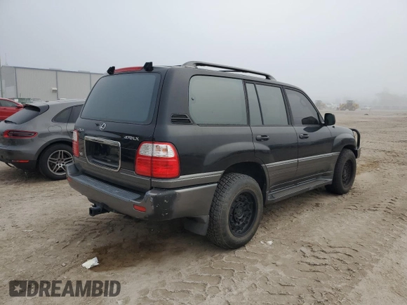 2001 Lexus LX 470 z VIN JTJHT00W513509447, wystawiony jako Copart lot #43988595 z przebiegiem 251 861 mil mil oraz Tytuł czysty. Historia ofert i sprzedaży dostępna na DreamBid. Obrazek 3.