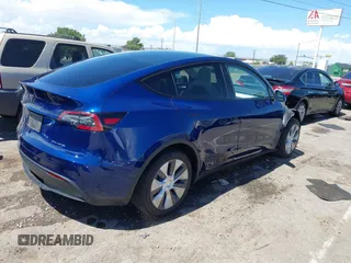 2024 Tesla Model Y Long Range with VIN 7SAYGDEE6RA242980, listed as a IAAI auction lot 40121685 with 9,126 mi miles and . Bid and sale history available at DreamBid. Image 4.