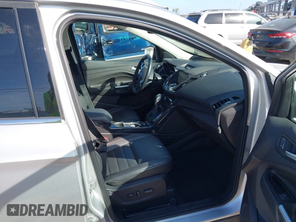 2016 Ford Escape Titanium with VIN 1FMCU0J94GUB11776, listed as a IAAI auction lot 41945655 with 119,949 mi miles. Bid and sale history available at carsss.com. Image 5.