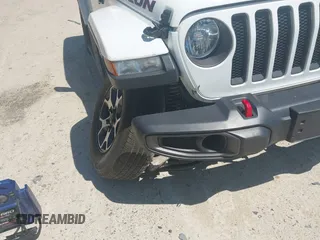 2021 Jeep Wrangler Unlimited Rubicon with VIN 1C4HJXFG5MW586842, listed as a IAAI auction lot 42186683 with 76,450 mi miles and . Bid and sale history available at DreamBid. Image 6.