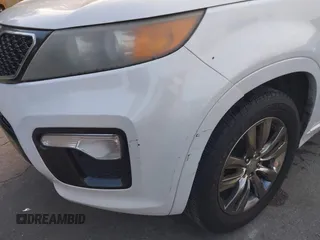 2012 Kia Sorento SX with VIN 5XYKW4A29CG224803, listed as a IAAI auction lot 41493527 with 228,065 mi miles. Bid and sale history available at carsss.com. Image 6.