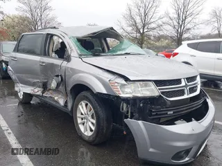 2016 Dodge Journey SXT with VIN 3C4PDDBG7GT173158, listed as a IAAI auction lot 42020182 with 159,136 mi miles. Bid and sale history available at carsss.com. Image 1.