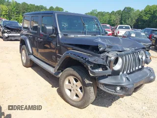 2018 Jeep Wrangler Unlimited Sahara z VIN 1C4HJXEN4JW220074, wystawiony jako IAAI lot #42594747 z przebiegiem 138 558 mil mil oraz . Historia ofert i sprzedaży dostępna na DreamBid. Obrazek 1.