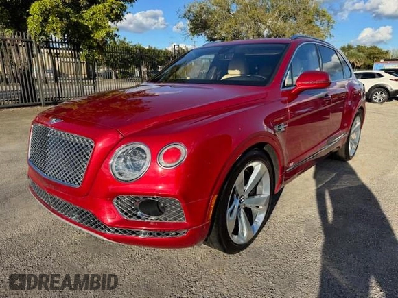 2017 Bentley Bentayga W12 z VIN SJAAC2ZV1HC014037, wystawiony jako Copart lot #54799655 z przebiegiem 36 099 mil mil oraz Szkody całkowita. Historia ofert i sprzedaży dostępna na DreamBid. Obrazek 1.