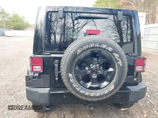 2015 Jeep Wrangler Unlimited Sahara with VIN 1C4HJWEG0FL661723, listed as a IAAI auction lot 41998393 with 89,077 mi miles. Bid and sale history available at carsss.com. Image 16.