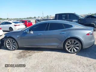 2014 Tesla Model S 60 with VIN 5YJSA1H1XEFP31911, listed as a IAAI auction lot 42029215 with Not Provided miles and . Bid and sale history available at DreamBid. Image 14.