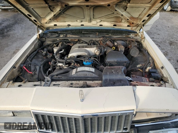 1987 Mercury Grand Marquis GS z VIN 2MEBM74F9HX714211, wystawiony jako Copart lot #43594205 z przebiegiem 26 933 mil mil oraz Szkody całkowita. Historia ofert i sprzedaży dostępna na DreamBid. Obrazek 11.