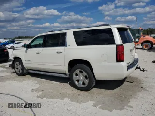 2015 Chevrolet Suburban LTZ with VIN 1GNSKKKC6FR119849, listed as a Copart auction lot 47176815 with 67,235 mi miles and Salvage Title. Bid and sale history available at carsss.com. Image 2.