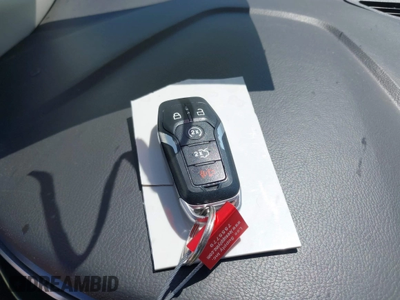 2016 Ford Fusion Titanium Hybrid z VIN 3FA6P0RUXGR123445, wystawiony jako IAAI lot #42606596 z przebiegiem 145 541 mil mil oraz . Historia ofert i sprzedaży dostępna na DreamBid. Obrazek 11.