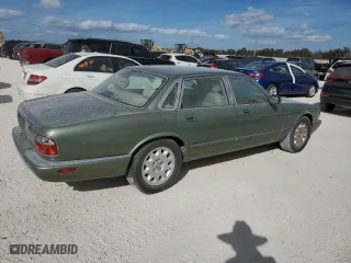1999 Jaguar XJ with VIN SAJHD1043XC869413, listed as a Copart auction lot 76940624 with 0 mi miles and Salvage Title. Bid and sale history available at carsss.com. Image 3.