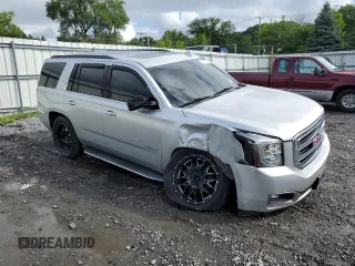 2015 GMC Yukon SLT with VIN 1GKS2BKC9FR518381, listed as a Copart auction lot 66352864 with 103,419 mi miles and Salvage Title. Bid and sale history available at carsss.com. Image 4.