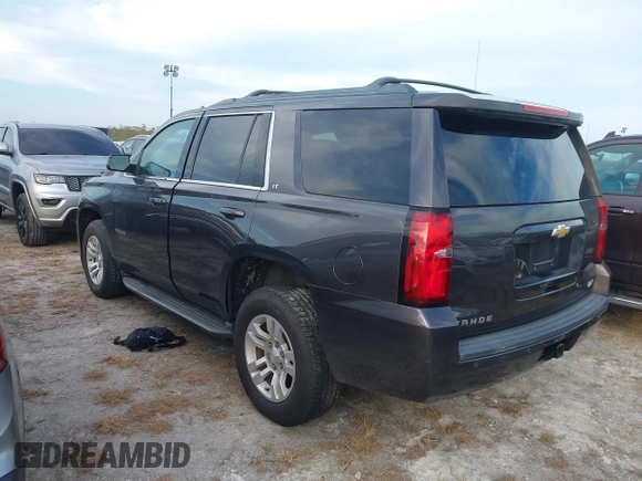 2017 Chevrolet Tahoe LT with VIN 1GNSKBKC3HR206093, listed as a IAAI auction lot 40602629 with 161,740 mi miles and . Bid and sale history available at DreamBid. Image 3.