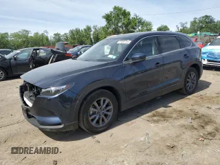 2023 Mazda CX-9 Touring z VIN JM3TCBCY4P0652834, wystawiony jako Copart lot #57668725 z przebiegiem 23 370 mil mil oraz Szkoda całkowita • Salvage title. Historia ofert i sprzedaży dostępna na DreamBid. Obrazek 1.