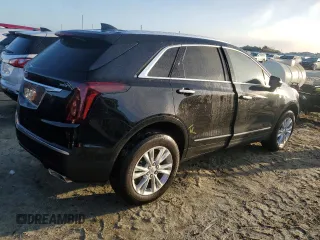 2022 Cadillac XT5 FWD Luxury z VIN 1GYKNAR49NZ159814, wystawiony jako Copart lot #74506584 z przebiegiem 7 069 mil mil oraz Nie do naprawy • Non repairable. Historia ofert i sprzedaży dostępna na DreamBid. Obrazek 3.