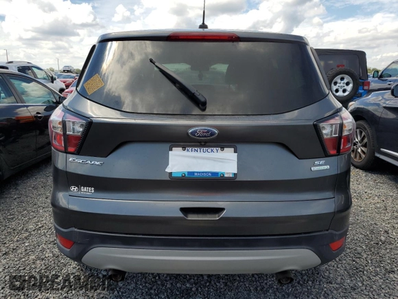 2017 Ford Escape SE z VIN 1FMCU0GDXHUE91333, wystawiony jako Copart lot #82061644 z przebiegiem Nie podano mil oraz Nie do naprawy • Non repairable. Historia ofert i sprzedaży dostępna na DreamBid. Obrazek 6.