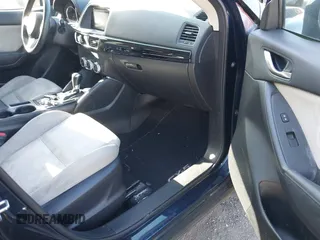 2016 Mazda CX-5 Sport with VIN JM3KE2BY3G0657904, listed as a IAAI auction lot 42127897 with 153,855 mi miles. Bid and sale history available at carsss.com. Image 5.