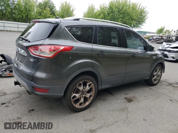 2015 Ford Escape Titanium with VIN 1FMCU9J93FUA67563, listed as a Copart auction lot 61770085 with 134,201 mi miles and Salvage title. Bid and sale history available at DreamBid. Image 3.