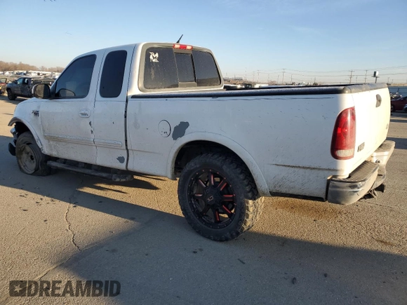 2000 Ford F-150 XL with VIN 1FTRX18L3YKA09007, listed as a Copart auction lot 42828005 with 218,563 mi miles and Salvage Title. Bid and sale history available at carsss.com. Image 2.