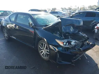 2014 Scion tC with VIN JTKJF5C79E3066327, listed as a IAAI auction lot 41349865 with 128,554 mi miles. Bid and sale history available at carsss.com. Image 1.