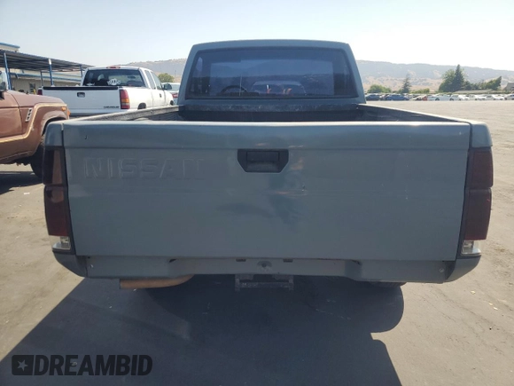 1990 Nissan Frontier with VIN 1N6SD11S9LC321876, listed as a Copart auction lot 59913575 with 119,909 mi miles and Salvage title. Bid and sale history available at DreamBid. Image 6.