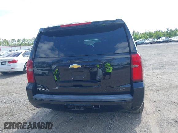 2015 Chevrolet Tahoe LT with VIN 1GNSCBKC1FR615817, listed as a IAAI auction lot 41760474 with 242,148 mi miles and . Bid and sale history available at DreamBid. Image 16.