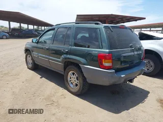 2001 Jeep Grand Cherokee Laredo with VIN 1J4GW48N51C612600, listed as a IAAI auction lot 42348631 with 165,918 mi miles and . Bid and sale history available at DreamBid. Image 3.