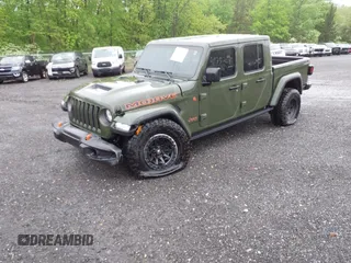 2023 Jeep Gladiator Mojave with VIN 1C6JJTEG6PL564504, listed as a IAAI auction lot 41752685 with 20,430 mi miles and . Bid and sale history available at DreamBid. Image 2.