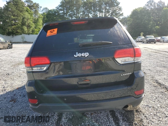 2018 Jeep Grand Cherokee Laredo E with VIN 1C4RJEAGXJC246874, listed as a Copart auction lot 56722005 with 101,493 mi miles and Salvage title. Bid and sale history available at DreamBid. Image 6.