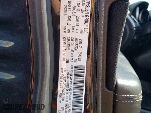 2012 Jeep Grand Cherokee SRT8 with VIN 1C4RJFDJ2CC352056, listed as a Copart auction lot 48810994 with 114,807 mi miles and Salvage Title. Bid and sale history available at carsss.com. Image 12.
