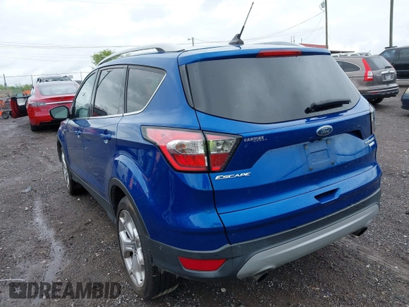 2018 Ford Escape Titanium with VIN 1FMCU0J97JUD34272, listed as a IAAI auction lot 42078237 with 87,783 mi miles and . Bid and sale history available at DreamBid. Image 3.