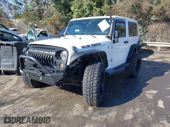 2014 Jeep Wrangler Sport with VIN 1C4AJWAG0EL245337, listed as a IAAI auction lot 41532314 with 140,721 mi miles and . Bid and sale history available at DreamBid. Image 2.
