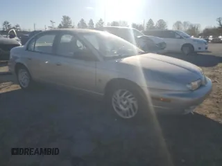 1999 Saturn SL with VIN 1G8ZK5270XZ147170, listed as a Copart auction lot 42169385 with 141,100 mi miles and Clean title. Bid and sale history available at DreamBid. Image 4.