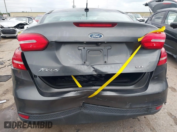 2017 Ford Focus SE z VIN 1FADP3F23HL325751, wystawiony jako IAAI lot #42182722 z przebiegiem 46 119 mil mil oraz . Historia ofert i sprzedaży dostępna na DreamBid. Obrazek 16.