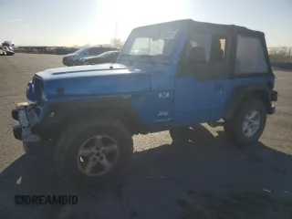 2003 Jeep Wrangler X with VIN 1J4FA39S33P320254, listed as a Copart auction lot 52392525 with 206,325 mi miles and Salvage title. Bid and sale history available at DreamBid. Image 1.