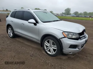 2014 Volkswagen Touareg Sport с VIN WVGEF9BP0ED014429, выставлен на аукционе Copart как лот 58692875 с пробегом 157 417 миль миль и Списание • Salvage title. История ставок и продаж доступна на DreamBid. Изображение 4.