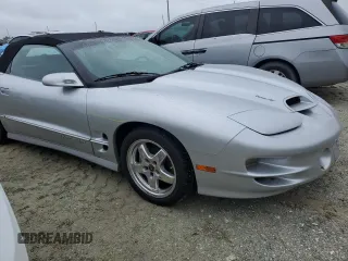 2002 Pontiac Firebird Trans Am z VIN 2G2FV32GX22126136, wystawiony jako Copart lot #74893254 z przebiegiem 7725 mil mil oraz Szkody całkowita. Historia ofert i sprzedaży dostępna na DreamBid. Obrazek 12.