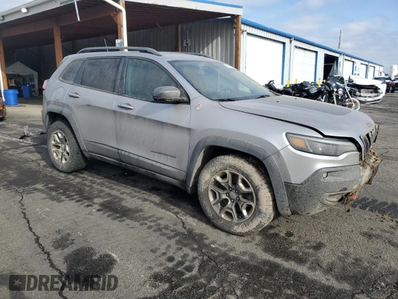 2019 Jeep Cherokee Trailhawk with VIN 1C4PJMBX8KD314746, listed as a Copart auction lot 51801135 with 124,281 mi miles and Salvage title. Bid and sale history available at DreamBid. Image 4.