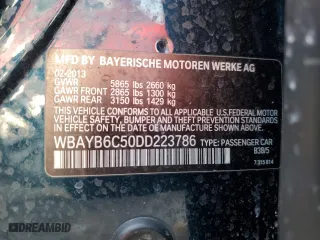 2013 BMW 7 Series 750i xDrive with VIN WBAYB6C50DD223786, listed as a Copart auction lot 87579345 with 143,523 mi miles and Salvage Title. Bid and sale history available at carsss.com. Image 12.