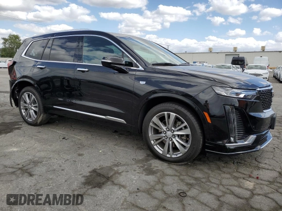 2023 Cadillac XT6 FWD Premium Luxury with VIN 1GYKPCRS5PZ220616, listed as a Copart auction lot 56913725 with 25,860 mi miles and Salvage title. Bid and sale history available at DreamBid. Image 4.