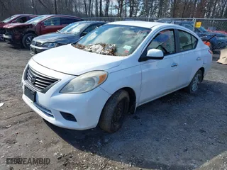 2012 Nissan Versa SL with VIN 3N1CN7AP9CL897641, listed as a IAAI auction lot 42004322 with 131,181 mi miles. Bid and sale history available at carsss.com. Image 2.